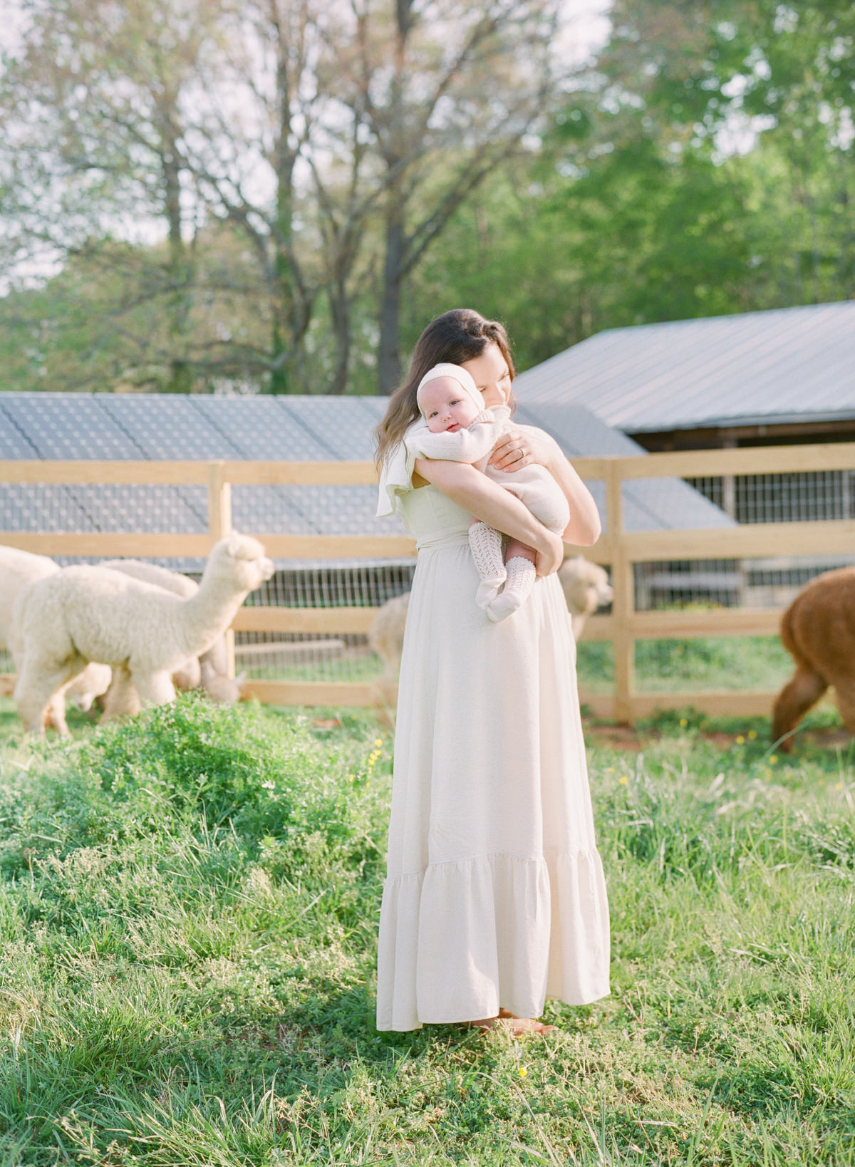 Kent-Avenue-Photography-Charlotte-Newborn-Photographers-On-Film-Mother-holding-baby
