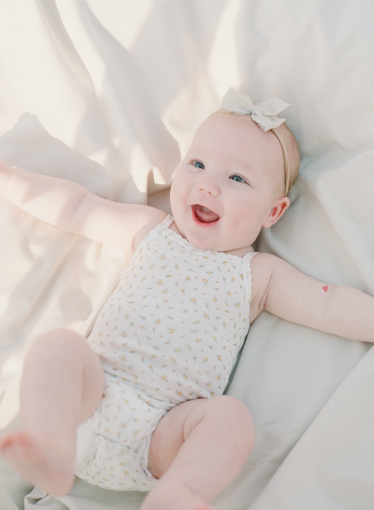 Kent-Avenue-Photography-Charlotte-Newborn-Photographers-On-Film-Baby-laughing-on-blanket
