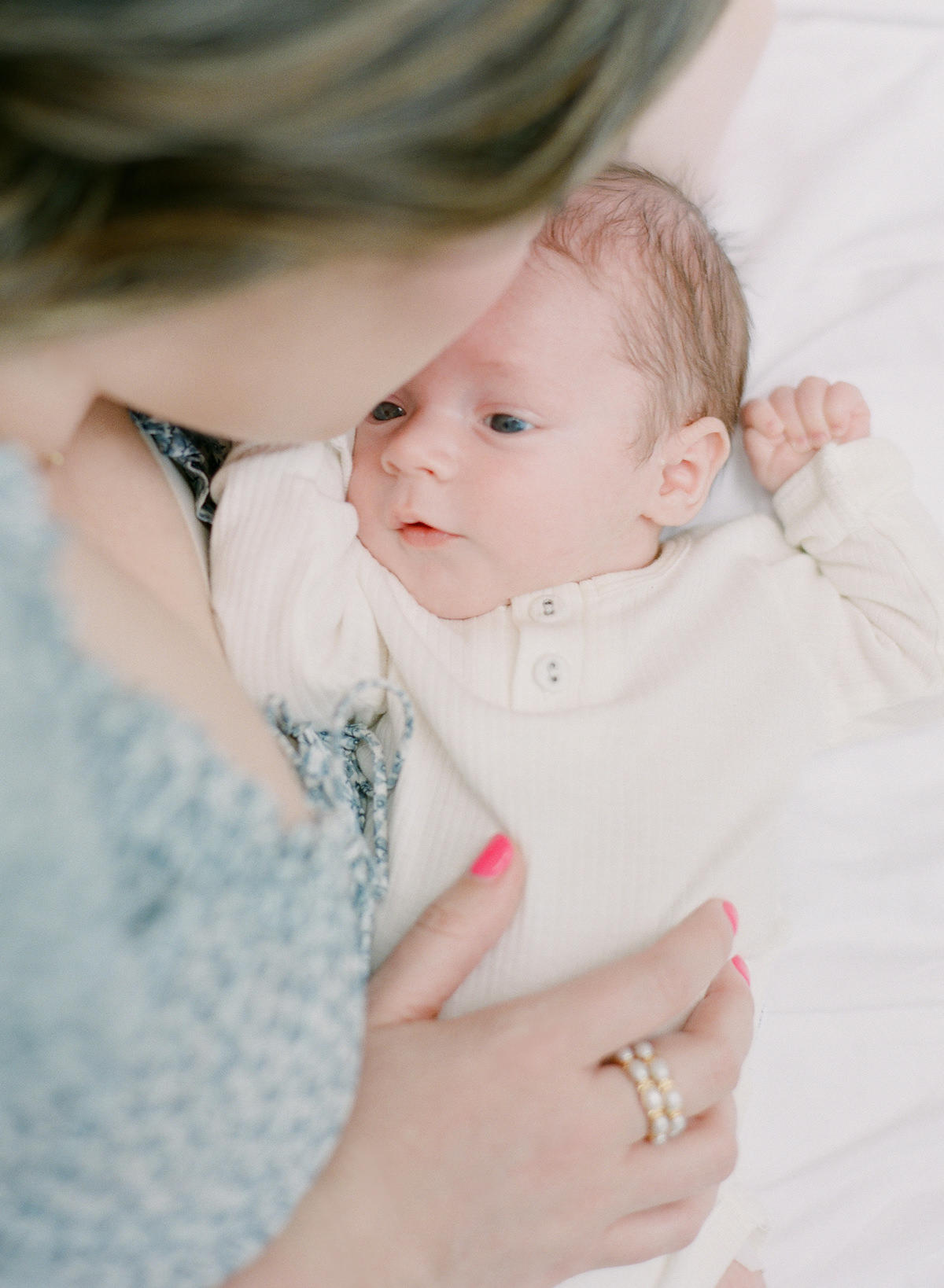 Charlotte Newborn Photographers On Film -  Mom kissing newborn - Kent Avenue Photography