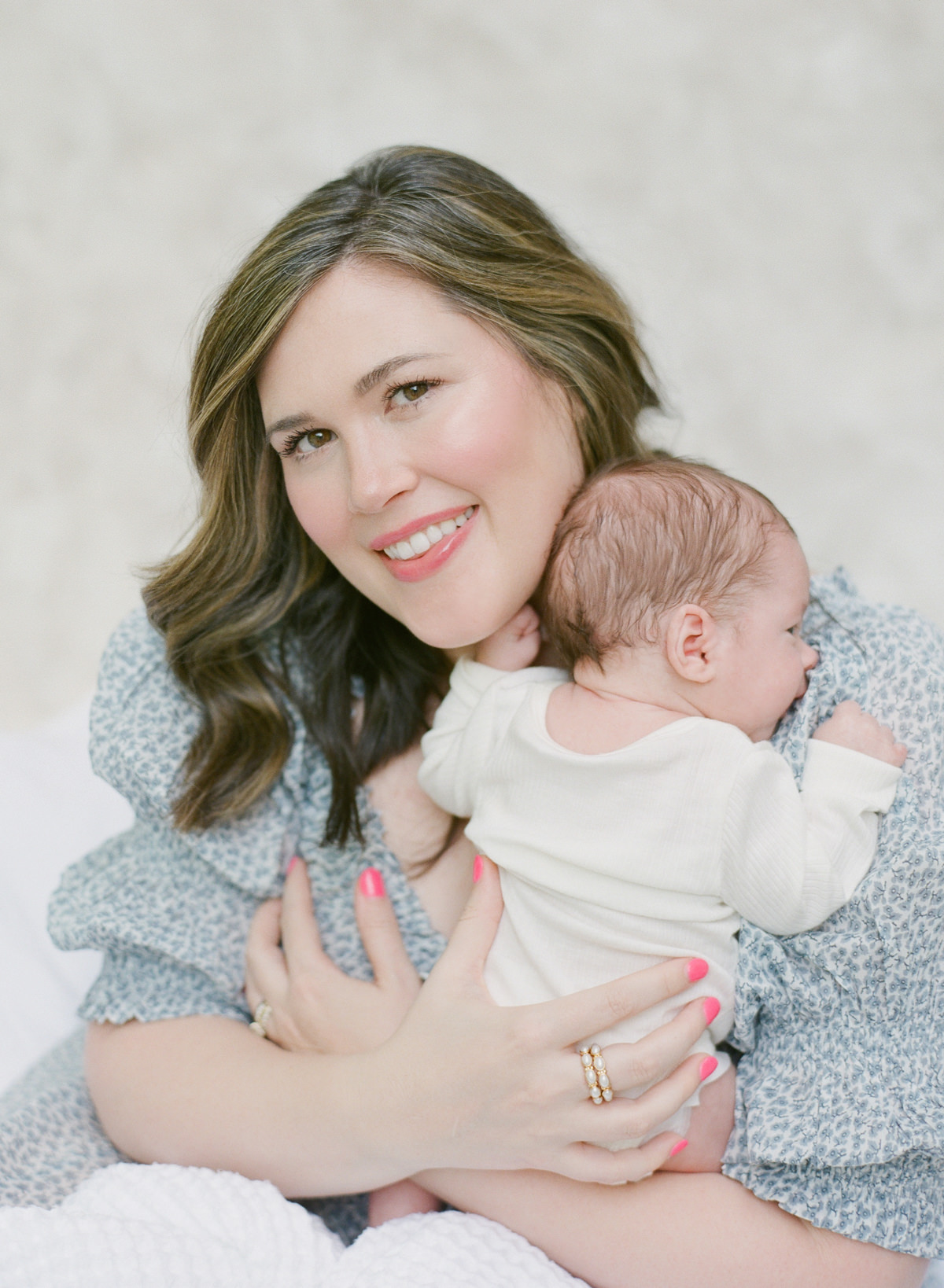 Charlotte Newborn Photography On Film - Mom holding baby smiling - Kent Avenue Photography