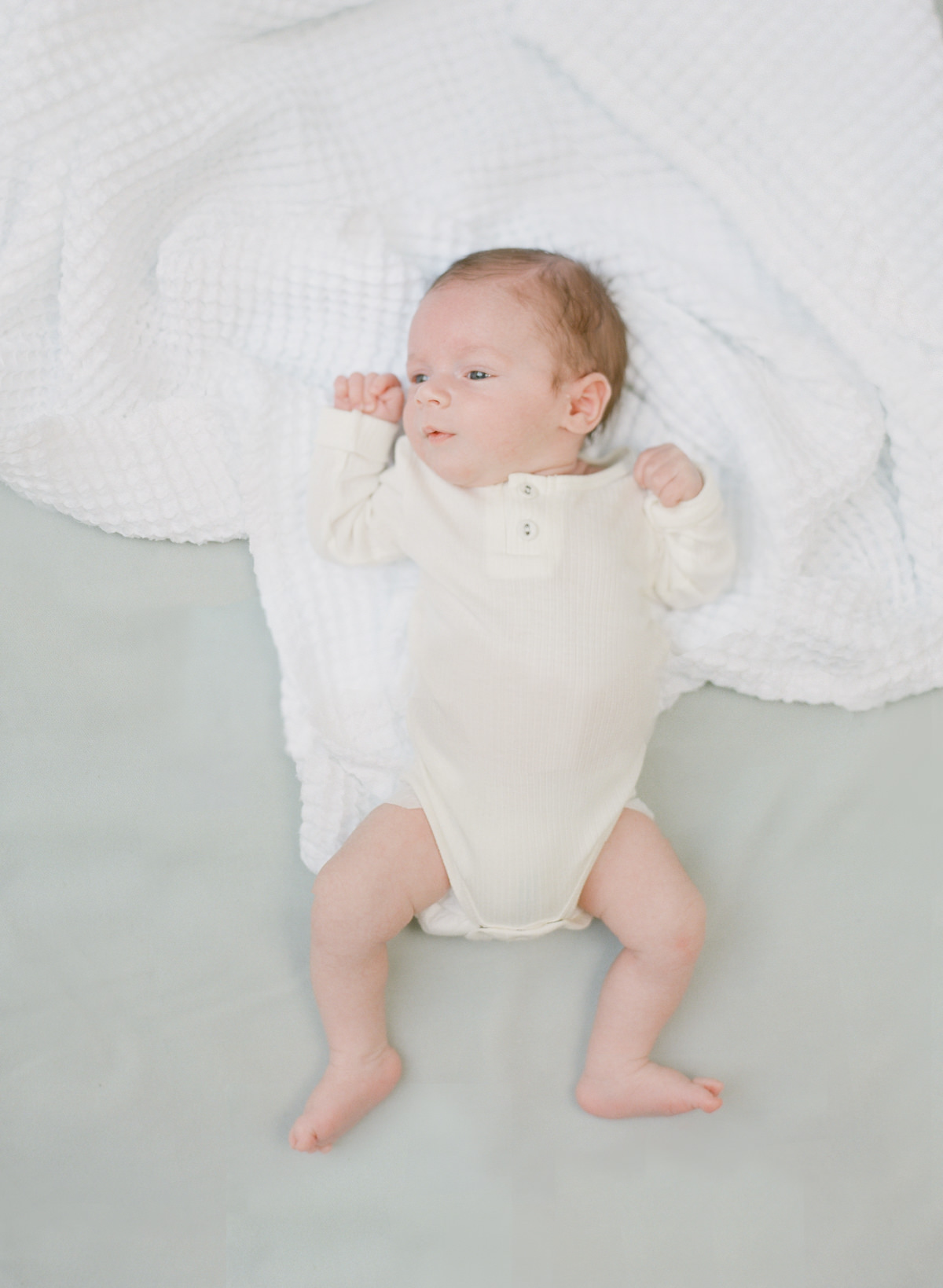 Kent-Avenue-Photography-Charlotte-Newborn-Photographers-On-Film-Newborn-Laying-On-Blanket
