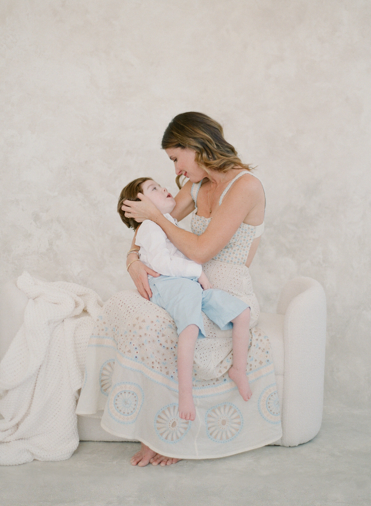 Charlotte Motherhood Photography on Film - Mother holding son - Portraiture with children with disabilities - California Motherhood Studio Session - Kent Avenue Photography - www.kentavenuephotography.com
