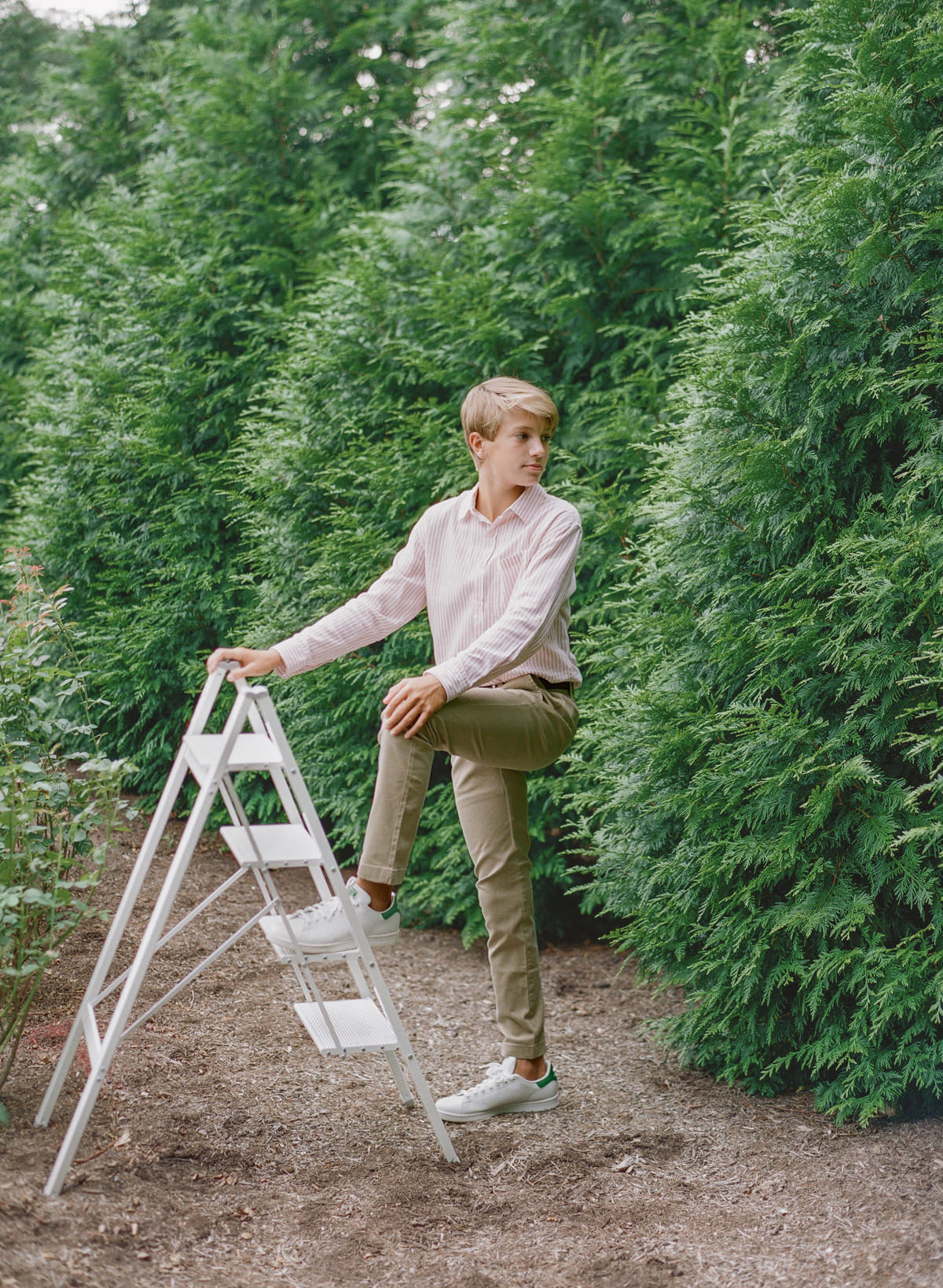 Portrait of teen boy with natural golden hour light in a Charlotte film session