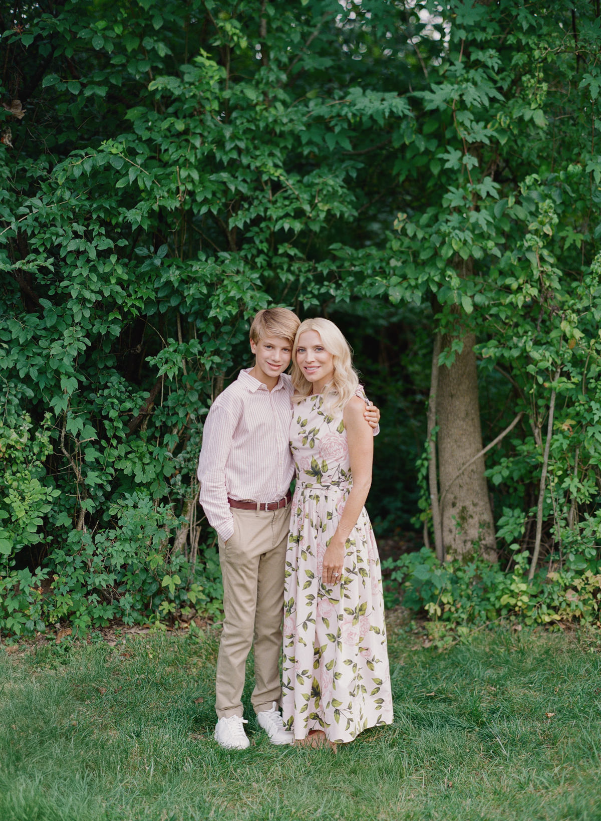 Mother laughing with her son in a candid Charlotte film family session